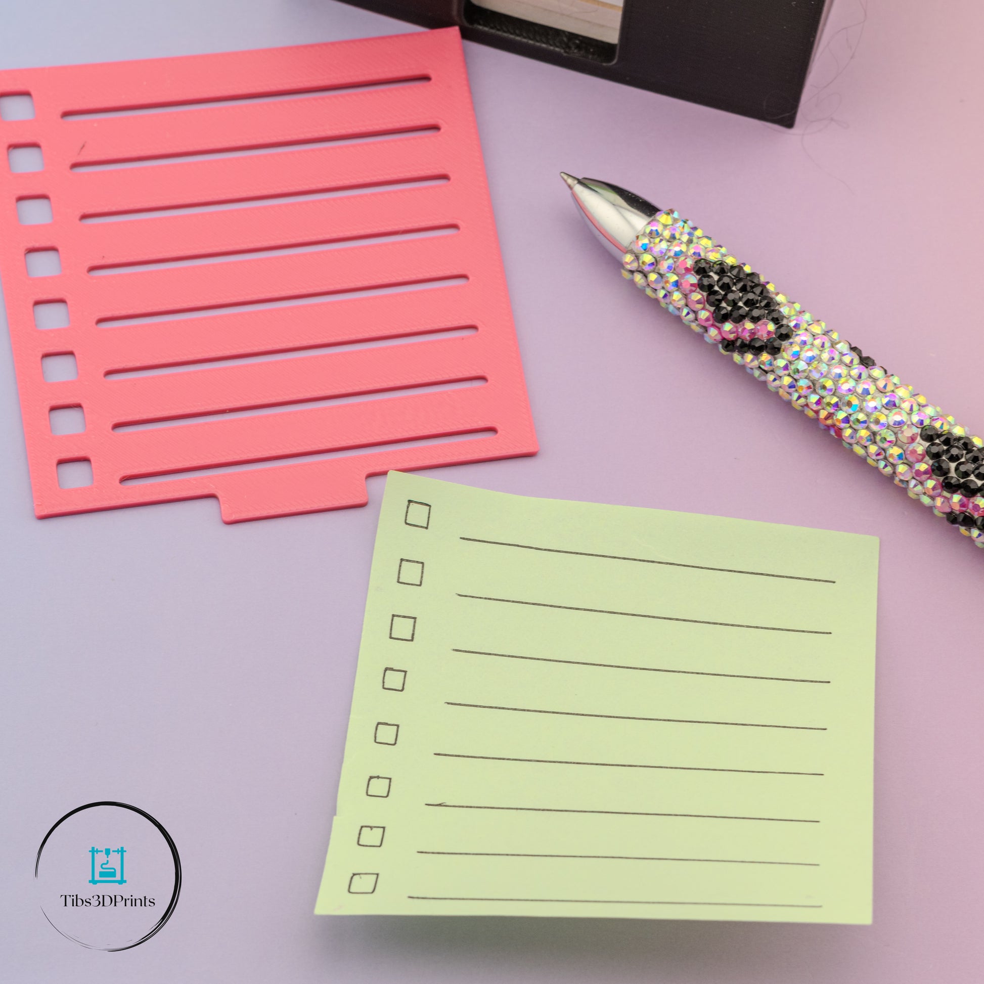 Sticky note holder in use on a desk, 3D printed by Tibs3DPrints