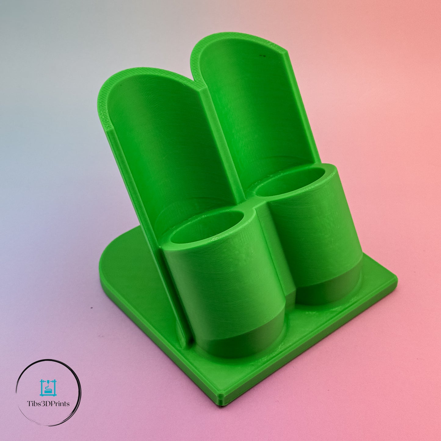 Green 3D printed glue holder — front view showing bottle slots for standard craft glue bottles