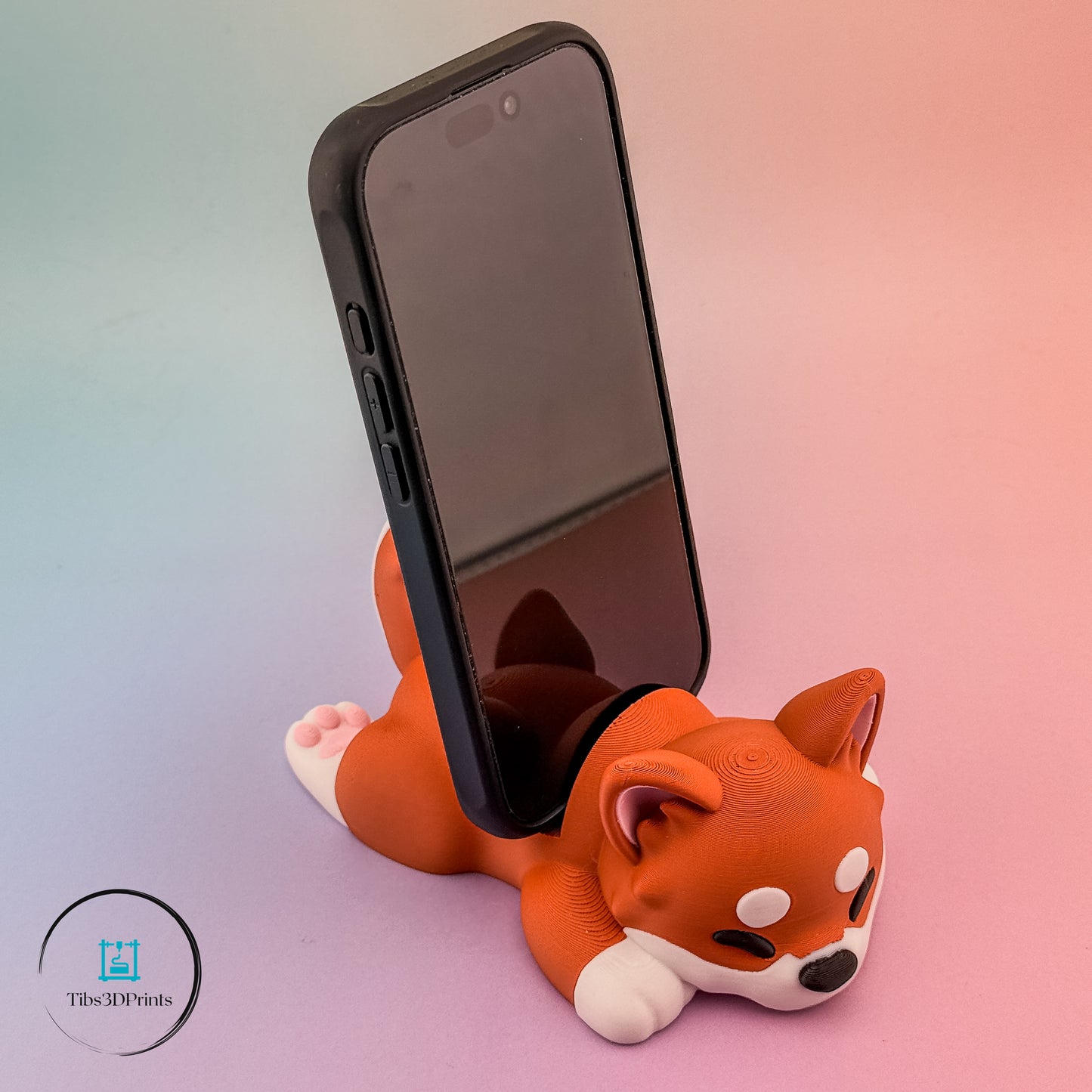 Sleepy Pup phone stand — snoozing dog cradling a phone, 3D printed by Tibs3DPrints